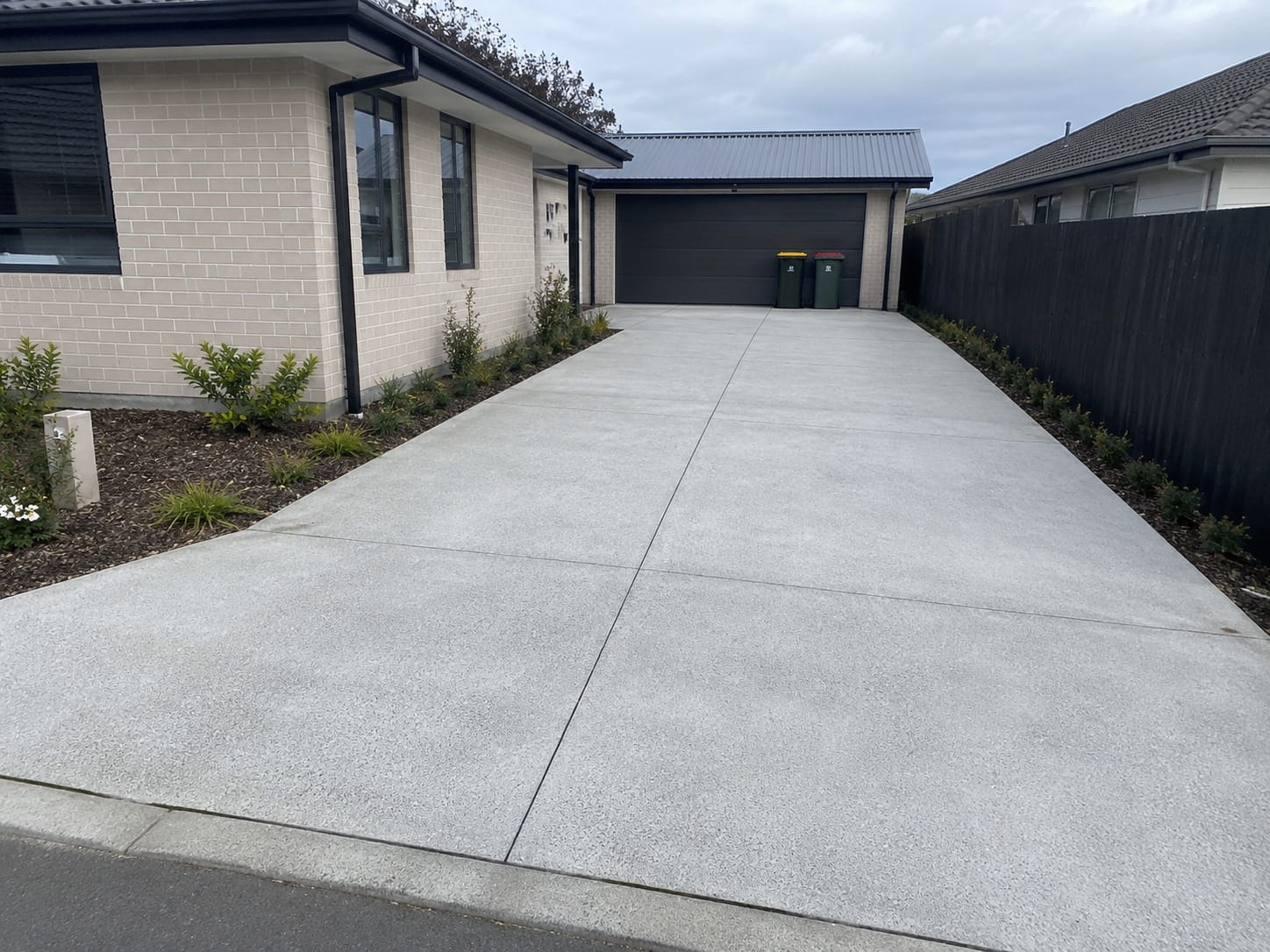 Premium exposed aggregate driveway for a new Tauranga home